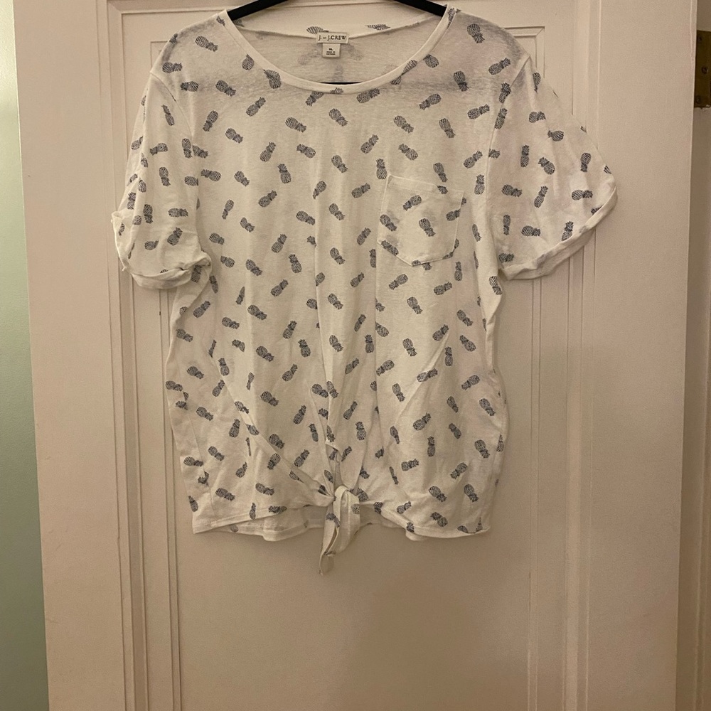 J crew brand short sleeve white t shirt with blue pineapples. .